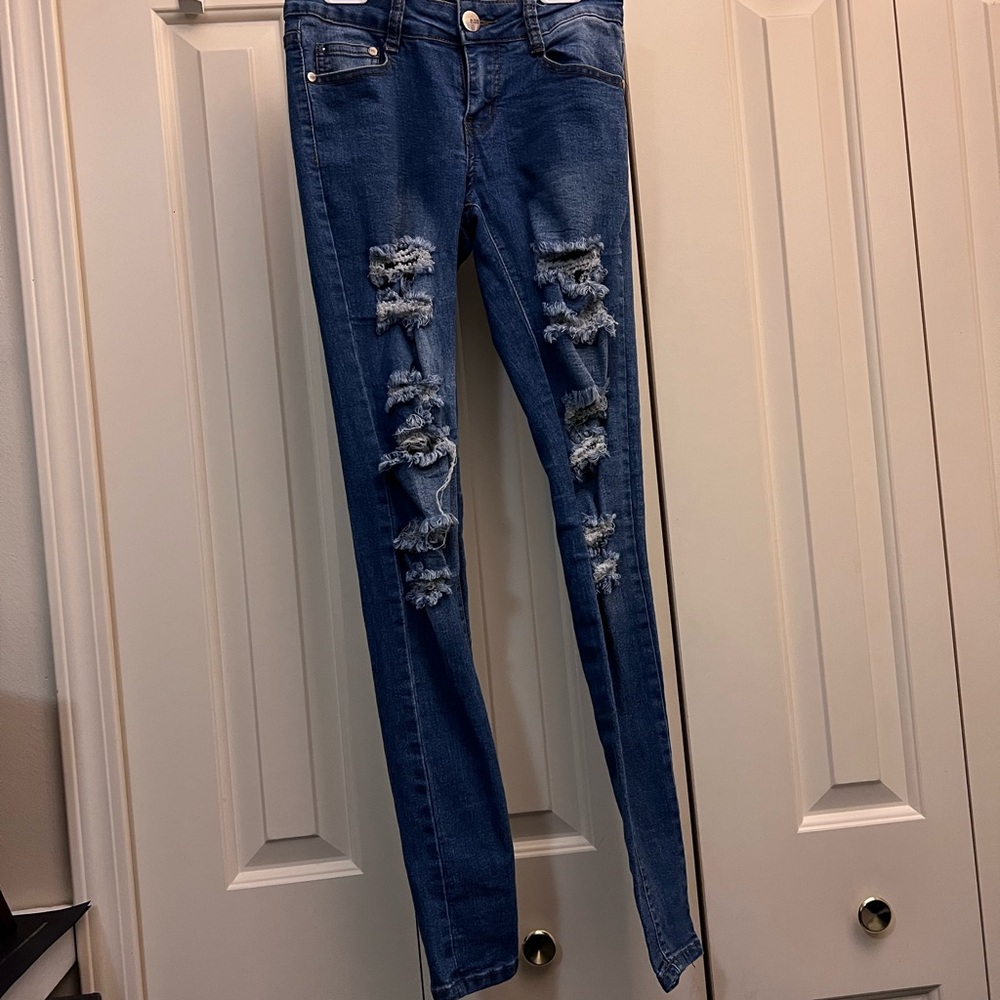 Distressed Medium Wash Fashion Nova Jeans. Size: 1/2